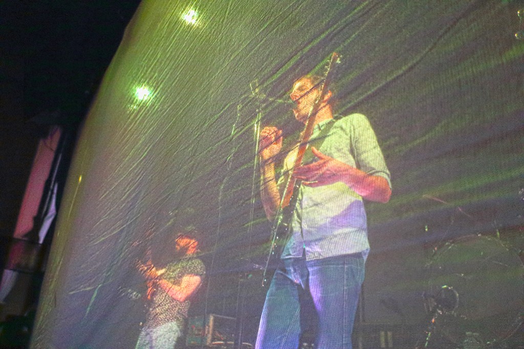 Ok Go started the show with mesh screens in front of them